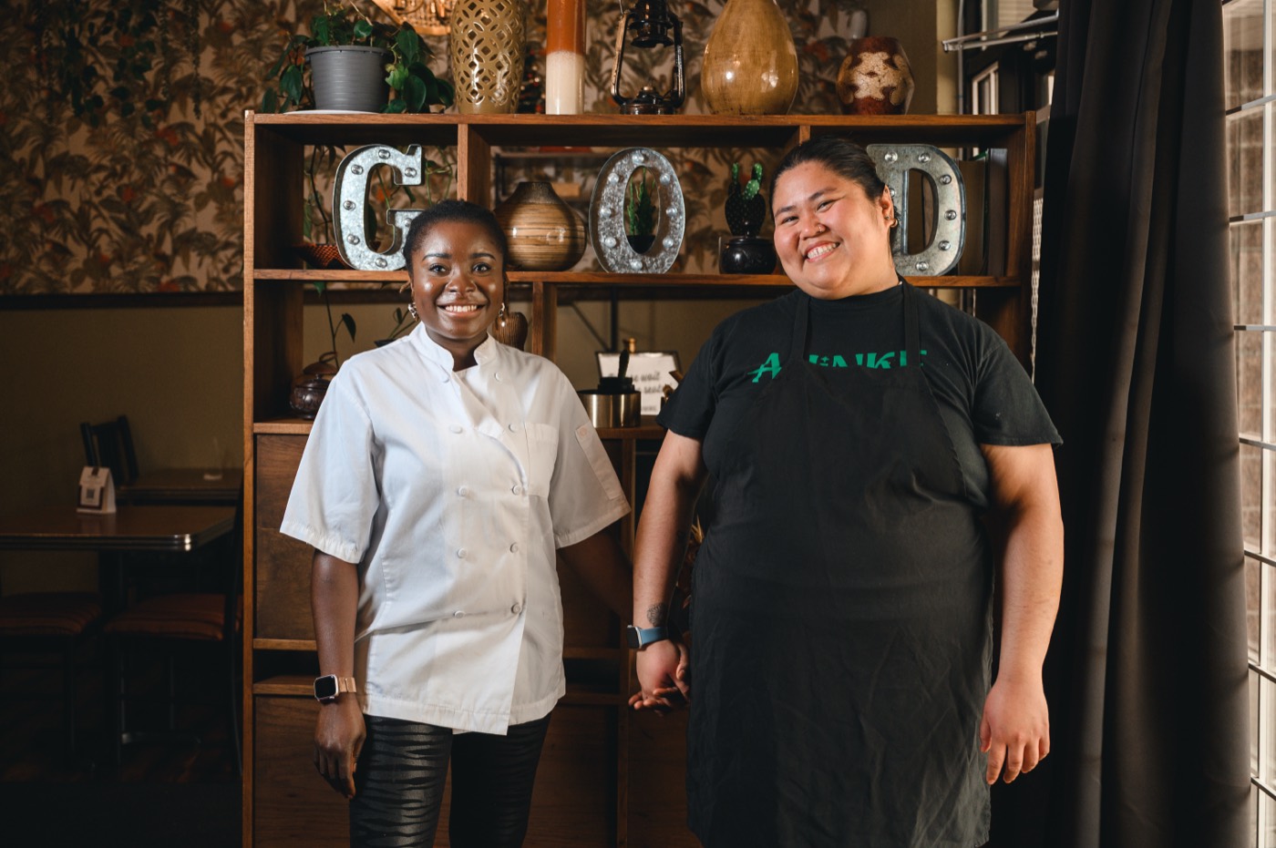 The Ahinke's team laughing together in the restaurant.