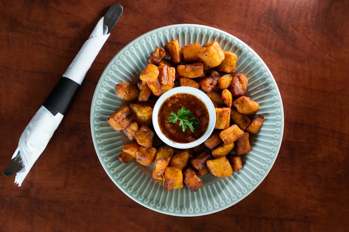 Fried plantain with pepper sauce.